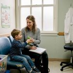 Parent and child at pediatrician office exam