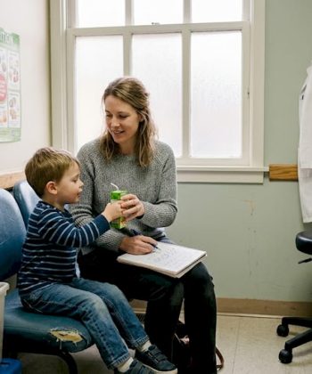 Parent and child at pediatrician office exam