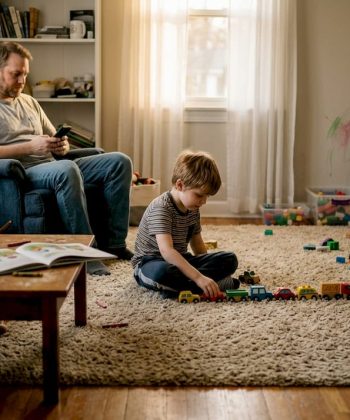 Autistic child quietly playing in living room