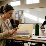 Parent reviewing documents at school meeting