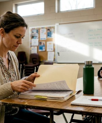 Parent reviewing documents at school meeting