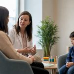 Pediatrician consulting mother about autism care