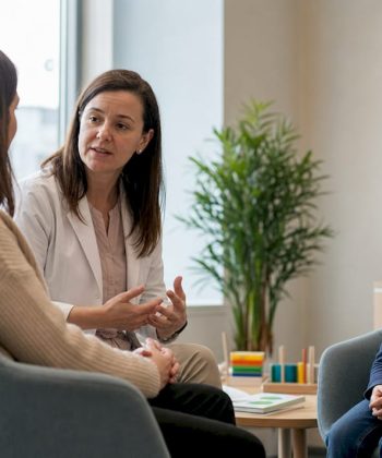 Pediatrician consulting mother about autism care