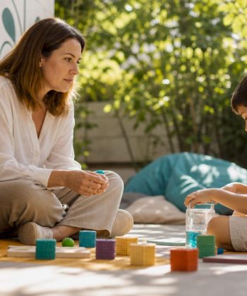Child psychologist interacting with autistic child